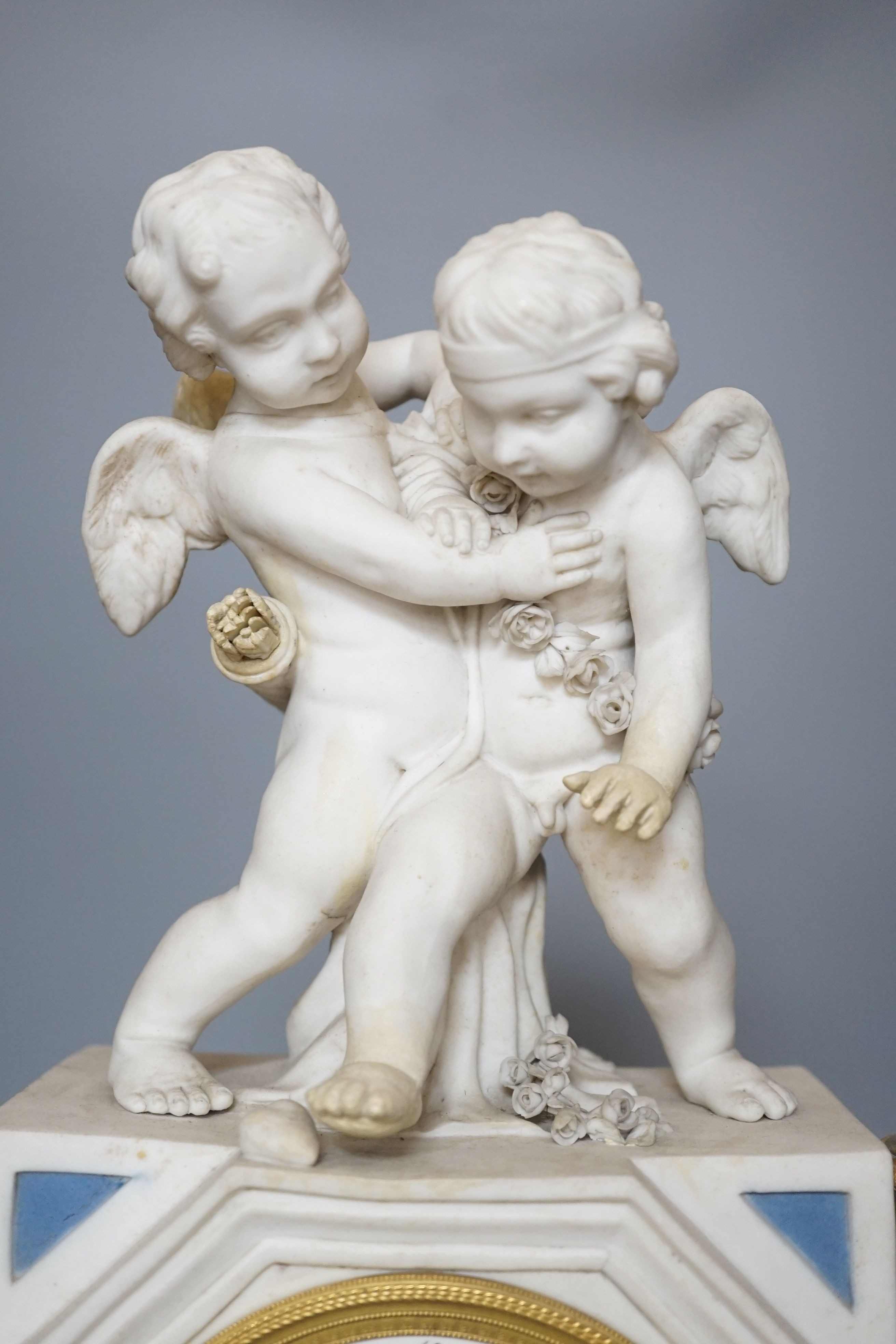 A 19th century French biscuit porcelain and ormolu mounted mantel clock, 43 cm high